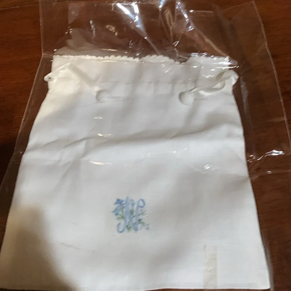 And beautiful hand made rare linen pouch with letter N hand dawn. Brand new!